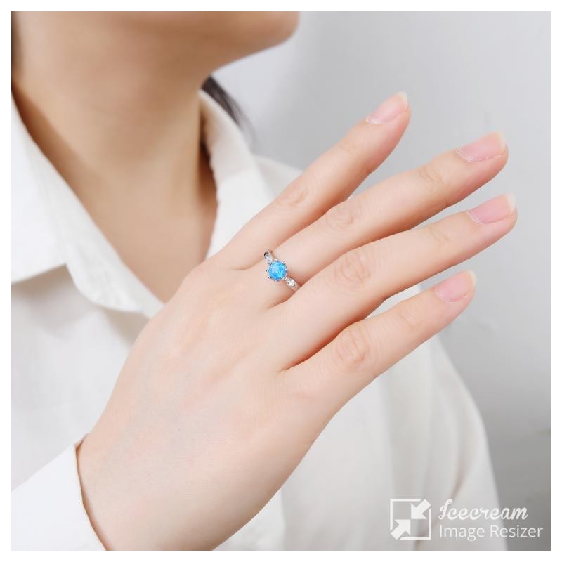 SREBRNY DAMSKI PIERŚCIONEK Z NIEBIESKIM OPALEM PRÓBA 925 ZARĘCZYNY